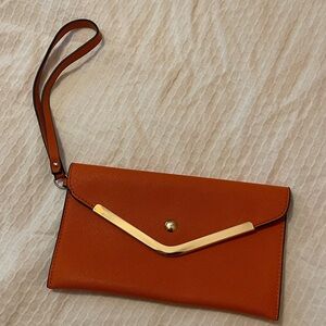Elegant Orange Clutch with Gold Accent